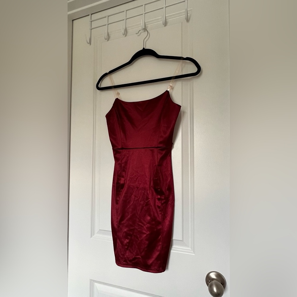 Satin maroon mini dress. Small pulling on dress. Can’t see when on.